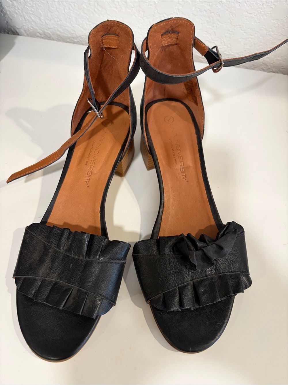 Unity in Diversity Black Ruffle Ankle-Strap Heels